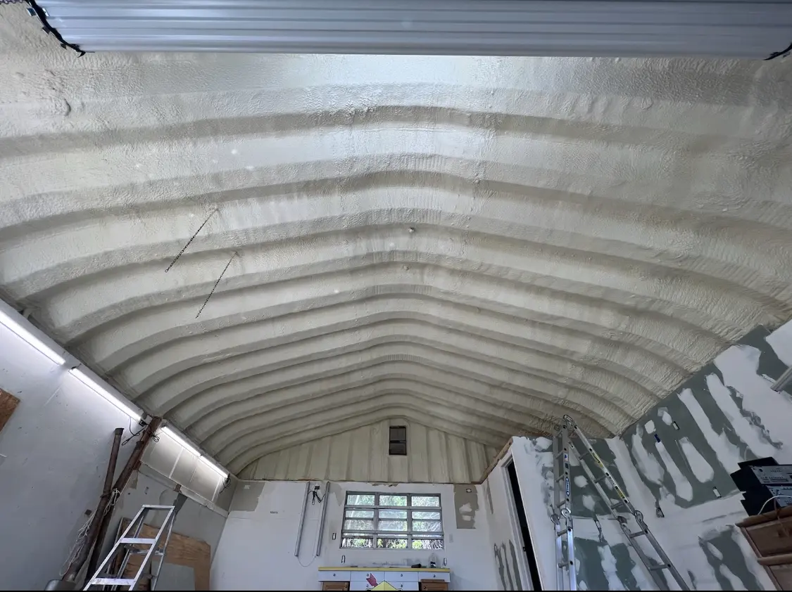 Spray polyurethane foam applied to the underside of a metal roof deck in Wyldwood